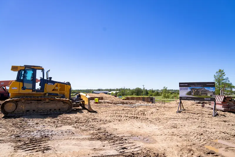 Central MN Dermatology site in Brainerd with a dozer and the project sign