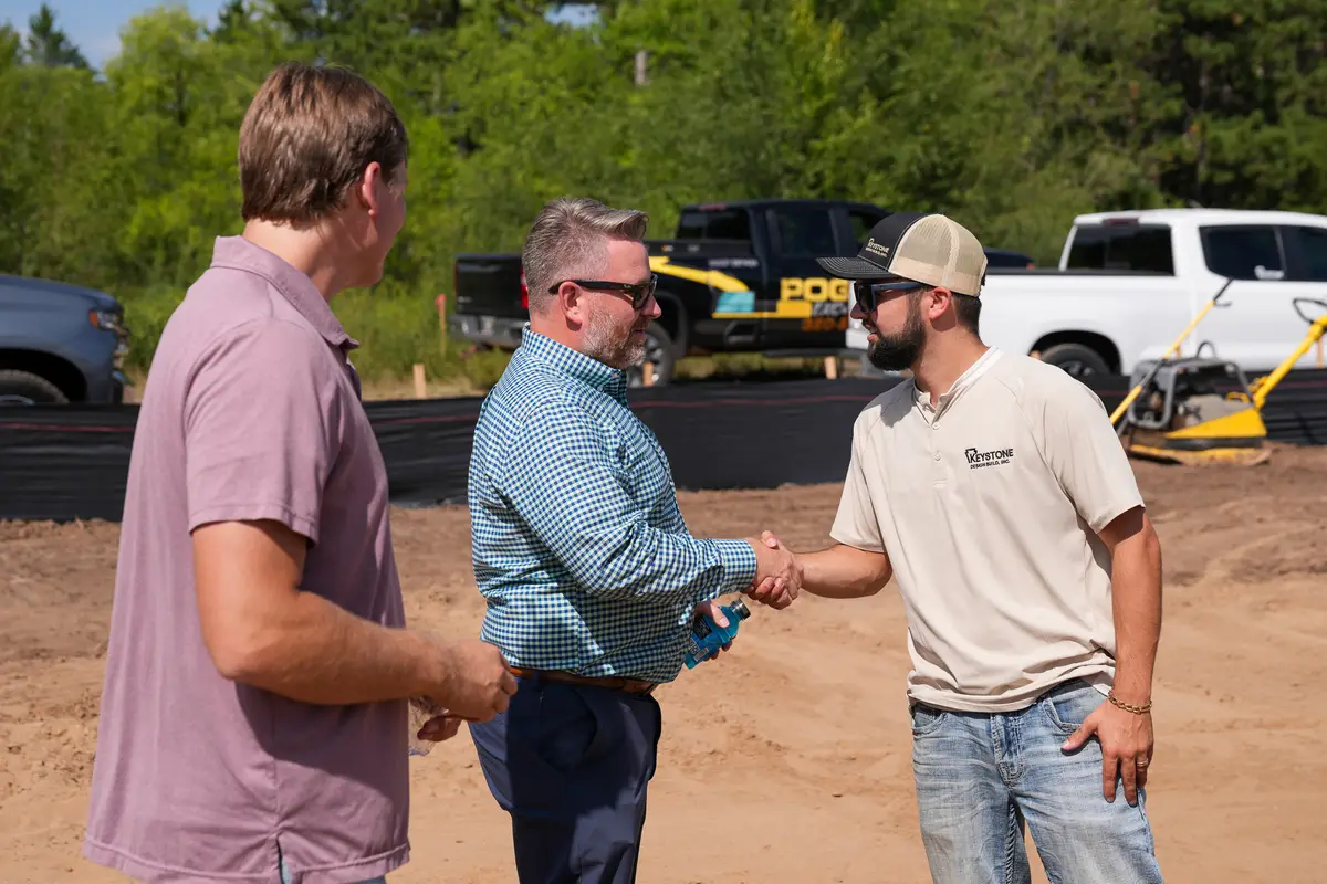 Handshake on site at the MN Signature Care groundbreaking